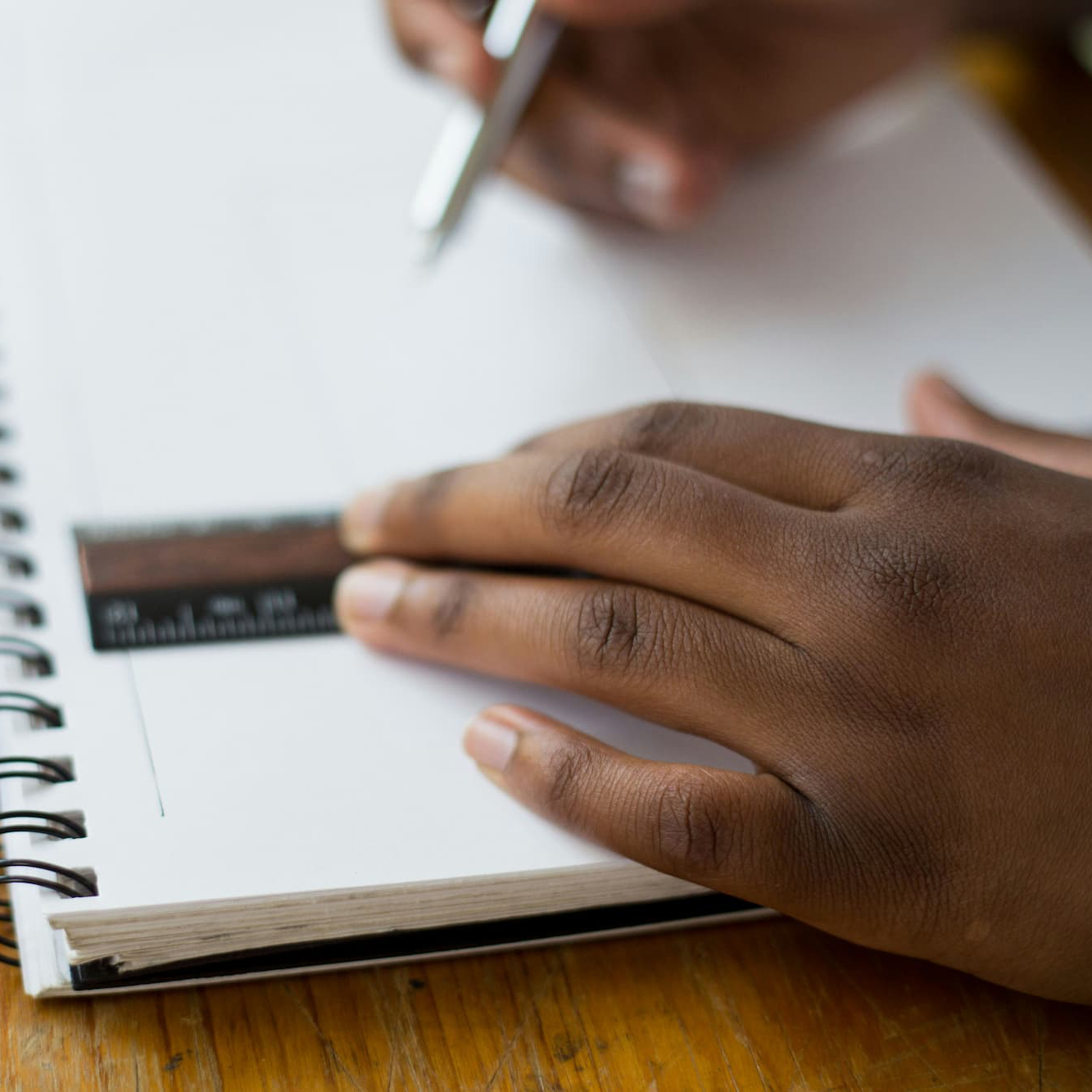 tamarcus-brown-ruler-drawing-unsplash-square Child's hands hold pen and ruler. Photo by Tamarcus Brown, Unsplash.