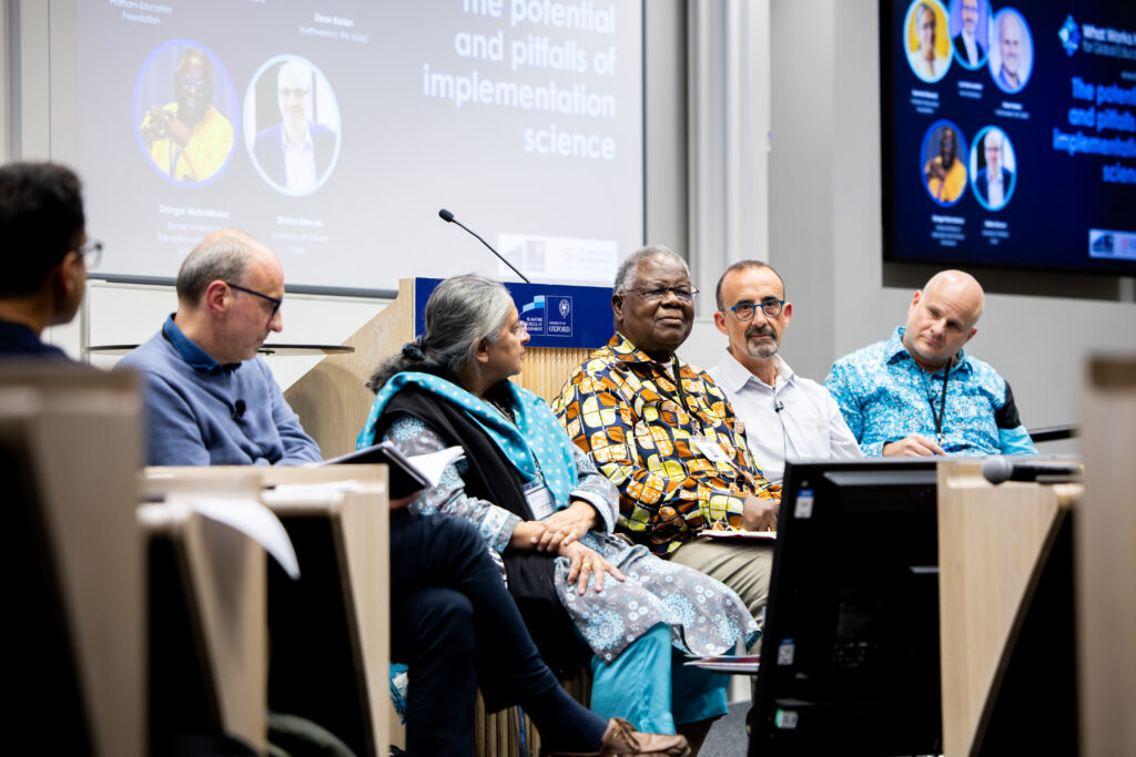 The speakers and chair in conversation during their panel at the What Works Hub for Global Education conference.
