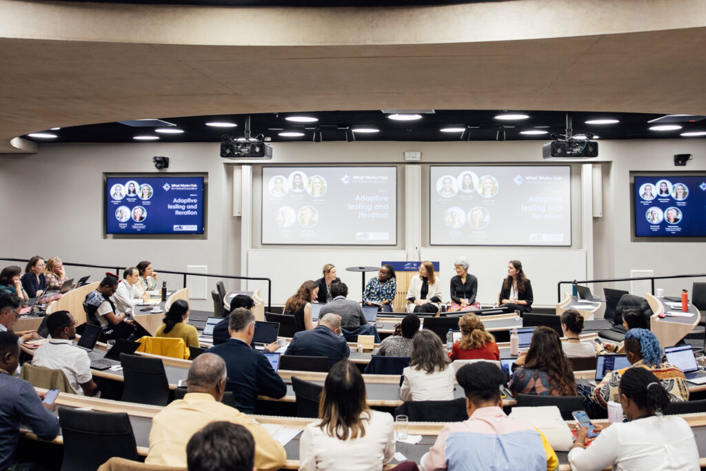 Photo of the 4 speakers in conversation during their panel at the What Works Hub for Global Education conference