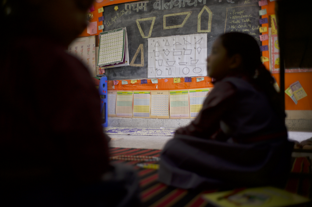 Instructions for the “Reading Maps” math game are posted on the board of a classroom in Delhi, India in 2025.